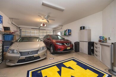 Garage with ceiling fan and a garage door opener