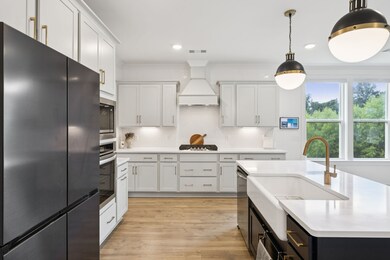 The massive farmhouse sink and oversized island offer both style and function, ideal for prepping and gathering.  3534 Madrid Way Murfreesboro, TN 37129