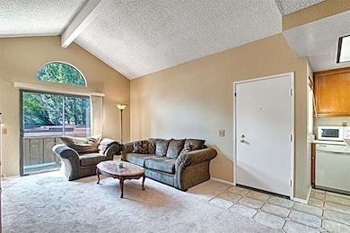 Tile floor in entry warps around into the kitchen.