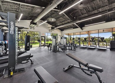 Exercise room with a high ceiling and healthy amo