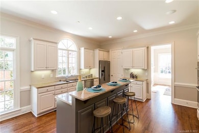 White solid wood cabinetry accented with a gray is