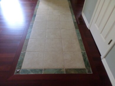 Beautiful inlaid Italian tile at entry door
