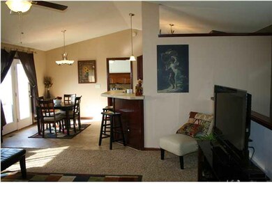 Alternate view of living room to dining area.
