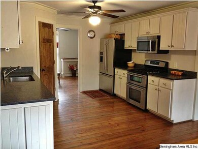 Kitchen has granite and stainless steel appliances