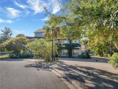 Looking into driveway at side view of home.  Home