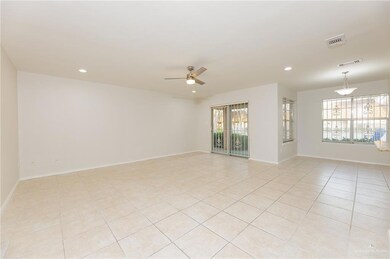 Unfurnished living room featuring ceiling fan, recessed lighting, baseboards, and light tile patterned floors