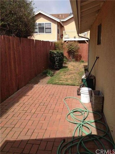 Brick patio leading to the back yard.