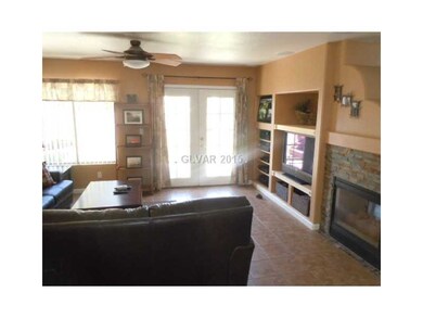 Property Photo. Family room with 3-way fireplace.