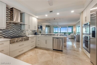 Kitchen with stainless steel appliances, quartz countertops, crown molding