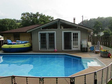 Exterior Back. Heated in-ground pool.