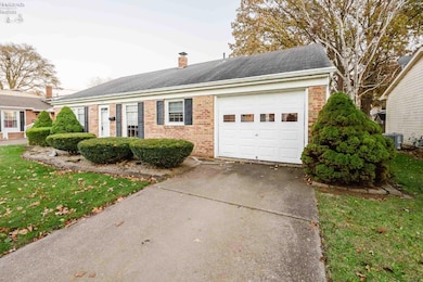 Attached heated garage w/back work shop.