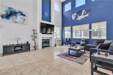 Tiled living room with a towering ceiling, a tiled