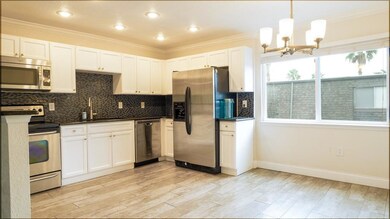 Great open kitchen with solid wood cabinets, stone