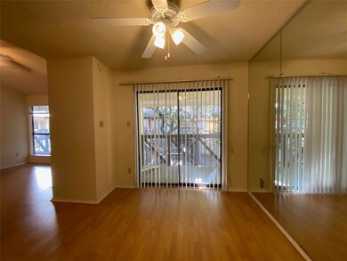 Empty room featuring ceiling fan, baseboards, and