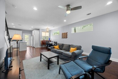 Living area with recessed lighting, dark wood-typ