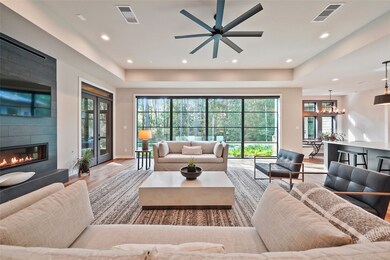 24x22  LIVING ROOM  24 ft wall of glass brings the outdoors in.