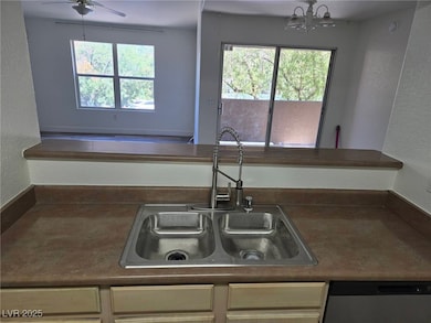 Kitchen with stainless steel dishwasher, a chandel