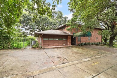 The large driveway and two car-garage can be acces