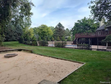 Surrounding community with a wooden deck, a patio area, and a swimming pool