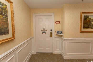 Interior space featuring wainscoting, a decorative