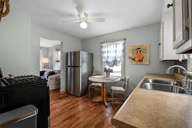 Luxury vinyl planks runs from the living room into the kitchen.