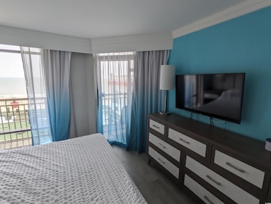 Bedroom featuring access to outside, multiple wind