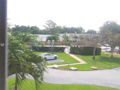 View of the pool area and gazebo from the second bedroom upstairs.  Lots of guest parking and this unit has 2 assigned parking spaces.