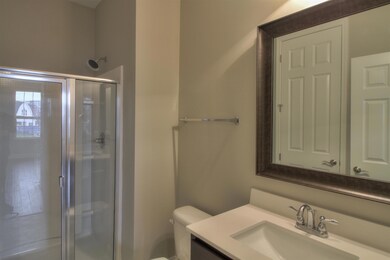 The hall bath is a full bath that's accessible to the hall and the front bedroom/office.