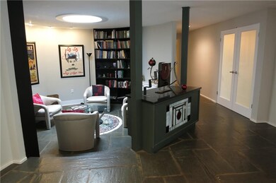 AS YOU ENTER THE FOYER, YOU ARE DRAWN INTO THE CIR