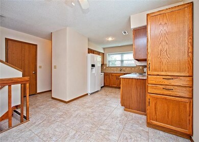 Kitchen Open to Family Room.  Frig Stays, Window P