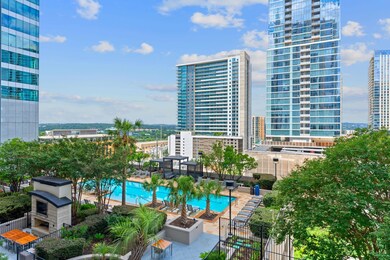 Community pool featuring a view of city