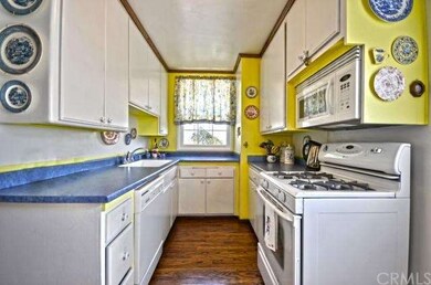 The kitchen opens to the dining area and living ro