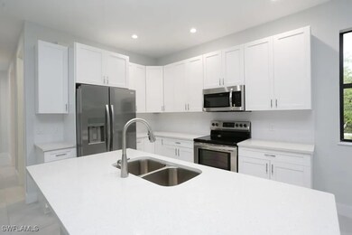 Kitchen featuring stainless steel appliances, sink