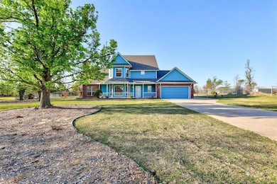 Established landscaping with flower beds in front 