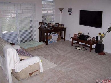 Spacious living room with sliding glass doors to t