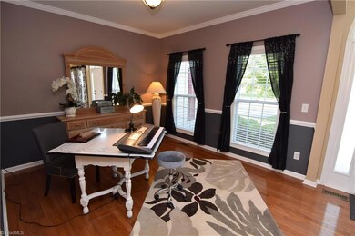 Gorgeous natural light and chair rail. A lovely room!