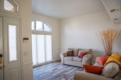 Living room with wood finished floors and baseboards