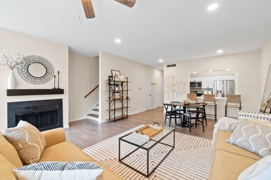 Modern, neutral-toned walls and flooring and cozy