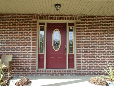 Double lighted front door.