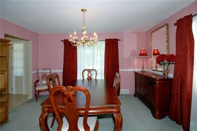 The dining room will easily accommodate your furni