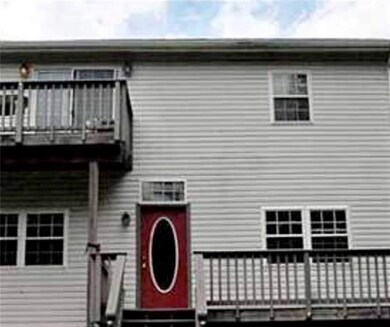 Front of house with wrap around deck and private M