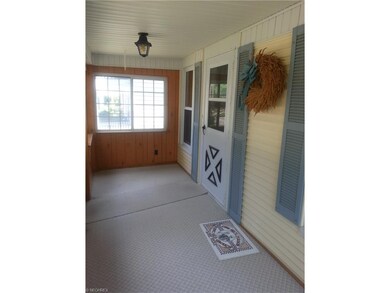 Spacious enclosed front porch with wall to wall ca