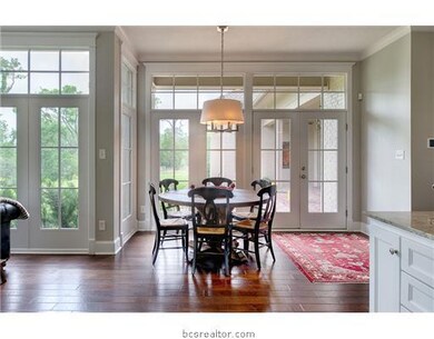 Dining Room. An amazing view of the backyard and patios from the breakfast area.