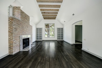Delightful den with high ceilings and wood beams.