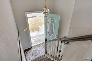 Entryway with hardwood / wood-style floors and a c