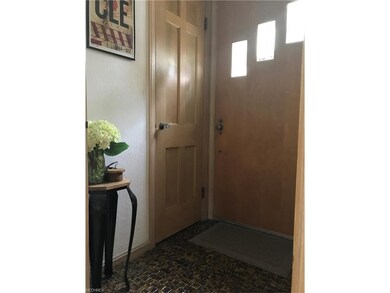 Formal entrance foyer with gorgeous tile and guest closet.