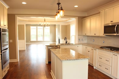 Alternate view of the kitchen. Great food prep island. Very open plan with view from front to rear of home. 