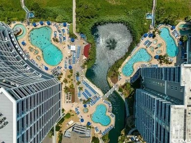 Aerial view of property's location with a pool area