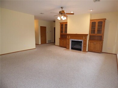 Large Living with Gas Log Fireplace and Built-in Bookcases