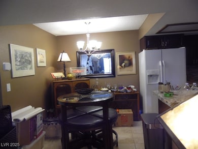 Dining room featuring light over dinning table, ti